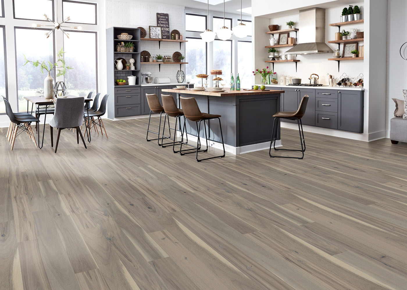 Open space kitchen and dining room with Virginia Mill Works Pearl Sands Acacia Solid Hardwood Flooring